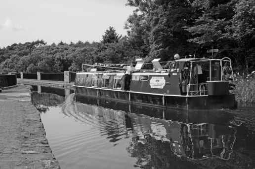 A barge sailing on a canal