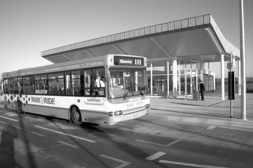 A bus parked at a park and ride